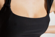 Photo of Черный бандо-купальник с металлическими деталями